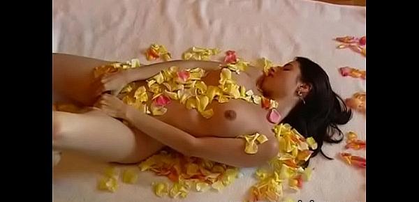  Playing with my pussy among the petals
